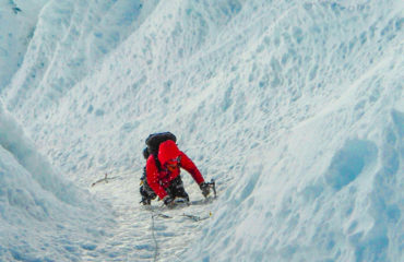 High on the fluted face of Alpamayo