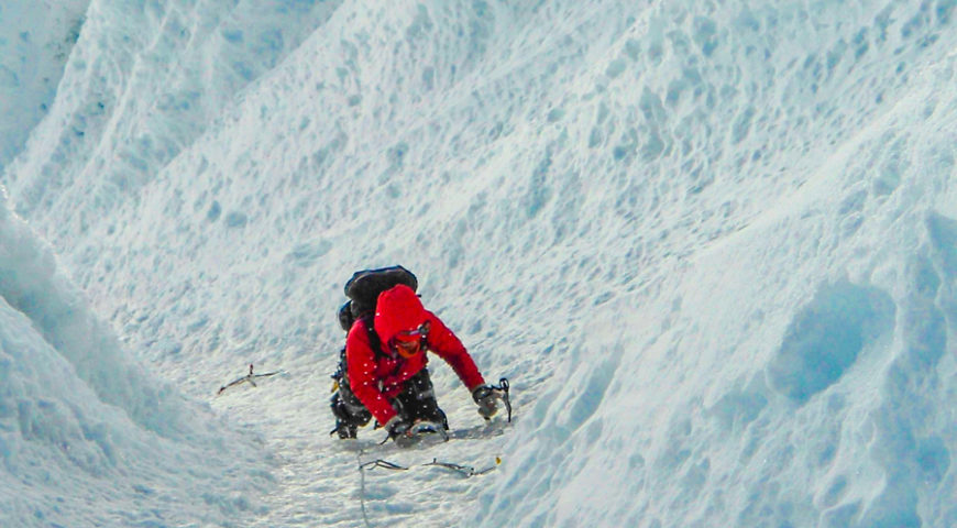 High on the fluted face of Alpamayo